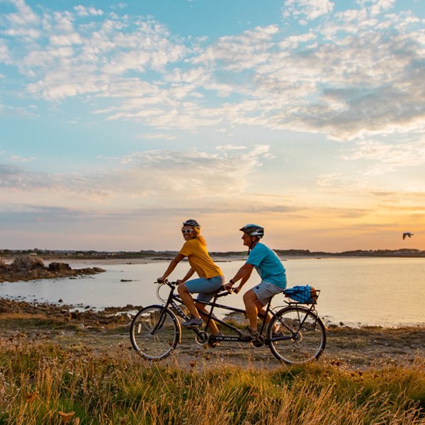 tandem-cycling-couple-coast.jpg
